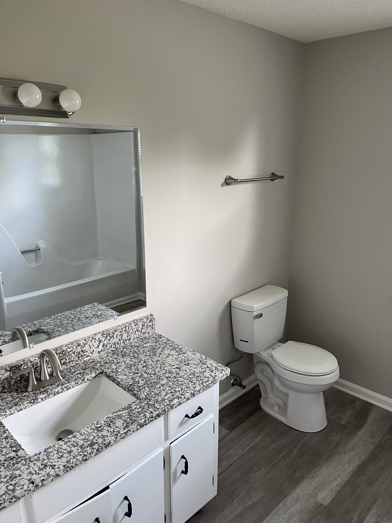 5380 Chicken Road Lebanon, TN 37090 - Photo 13 of 17 a bathroom with a granite countertop sink toilet and a mirror