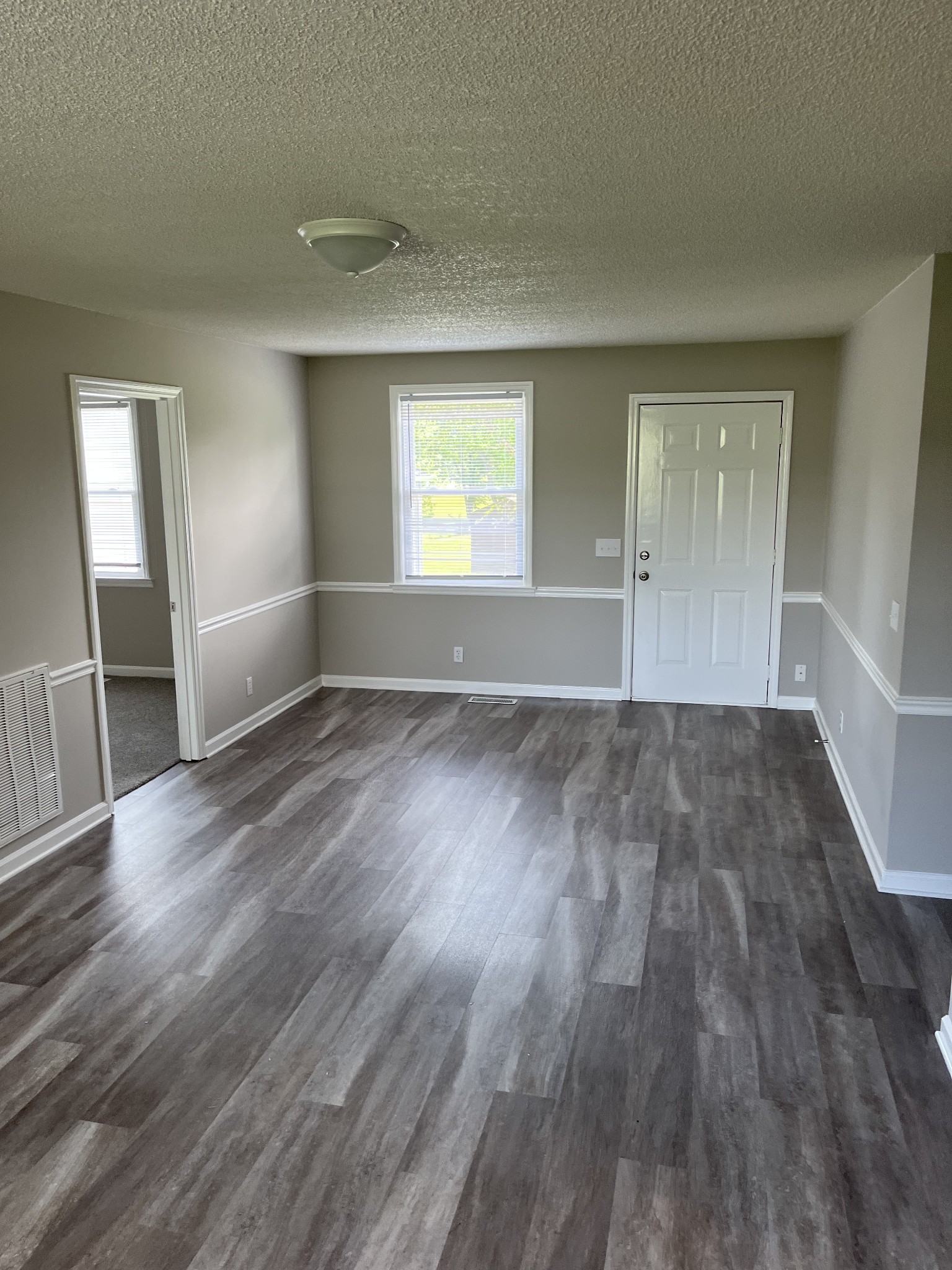 5380 Chicken Road Lebanon, TN 37090 - Photo 17 of 17 an empty room with wooden floor and windows