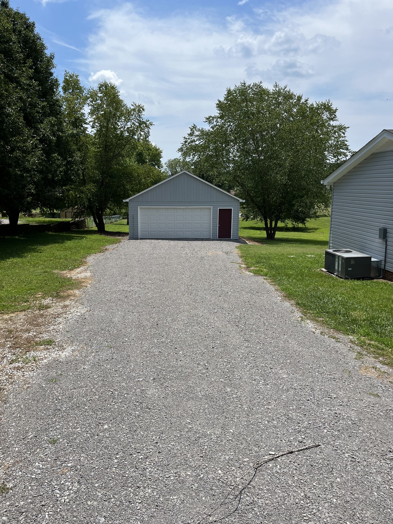 5380 Chicken Road Lebanon, TN 37090 - Photo 4 of 17 a house with a yard and a large parking space