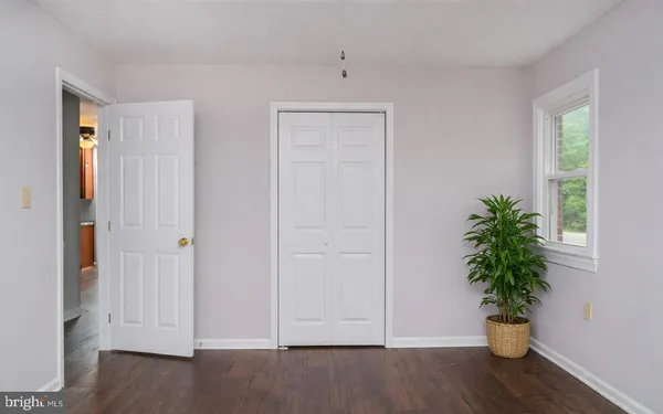a view of entryway with wooden floor