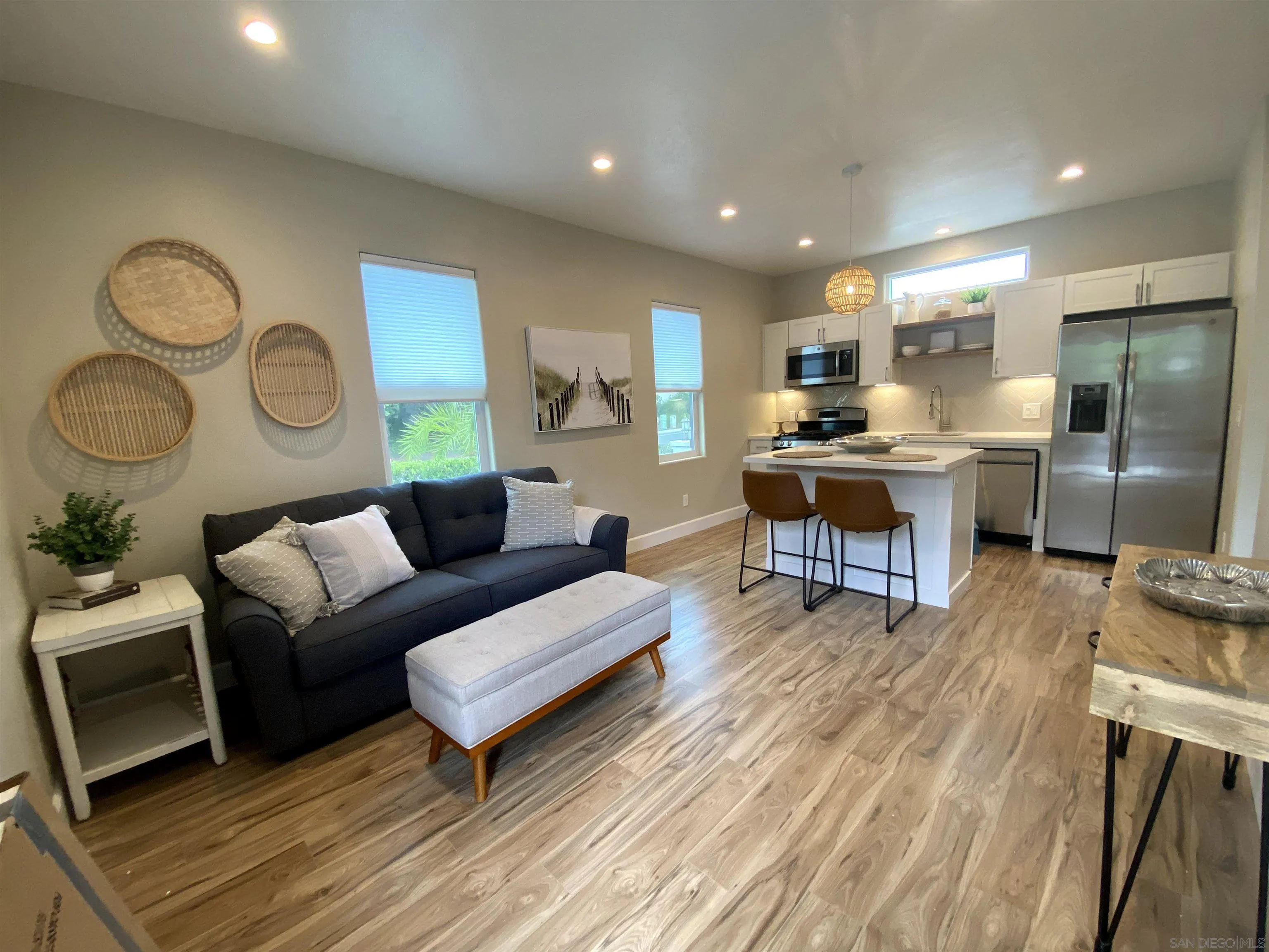 1774 Dove Lane Carlsbad, CA 92011 - Photo 1 of 25 a living room with furniture a rug and kitchen view