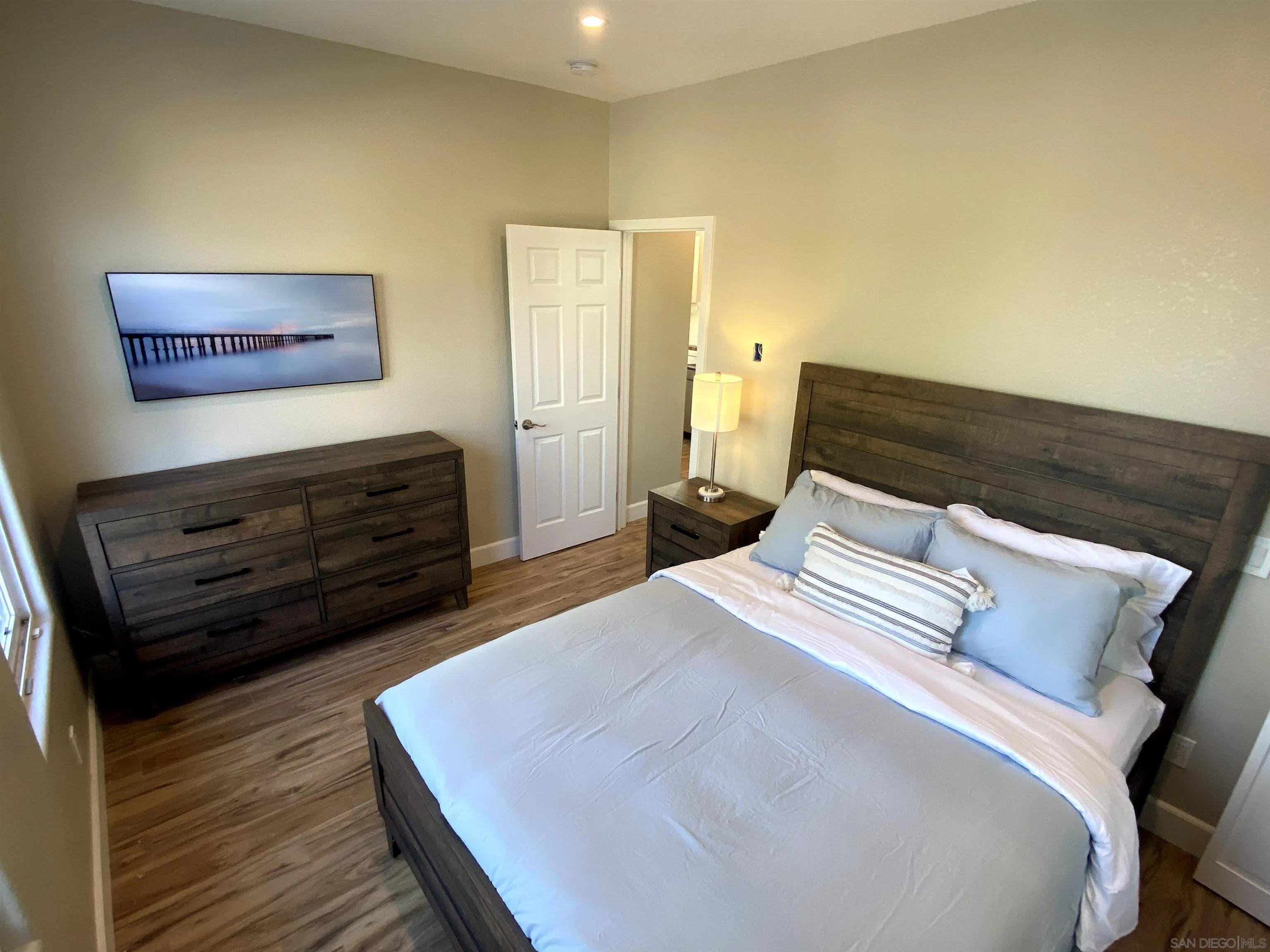 1774 Dove Lane Carlsbad, CA 92011 - Photo 11 of 25 a bedroom with a bed and a dresser