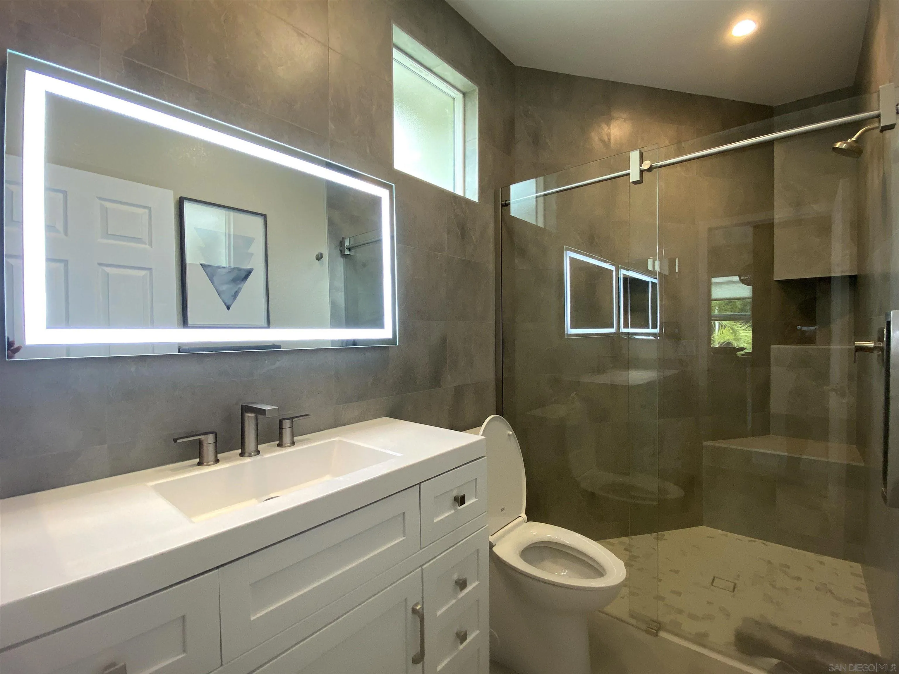 1774 Dove Lane Carlsbad, CA 92011 - Photo 17 of 25 a bathroom with a sink a toilet and shower