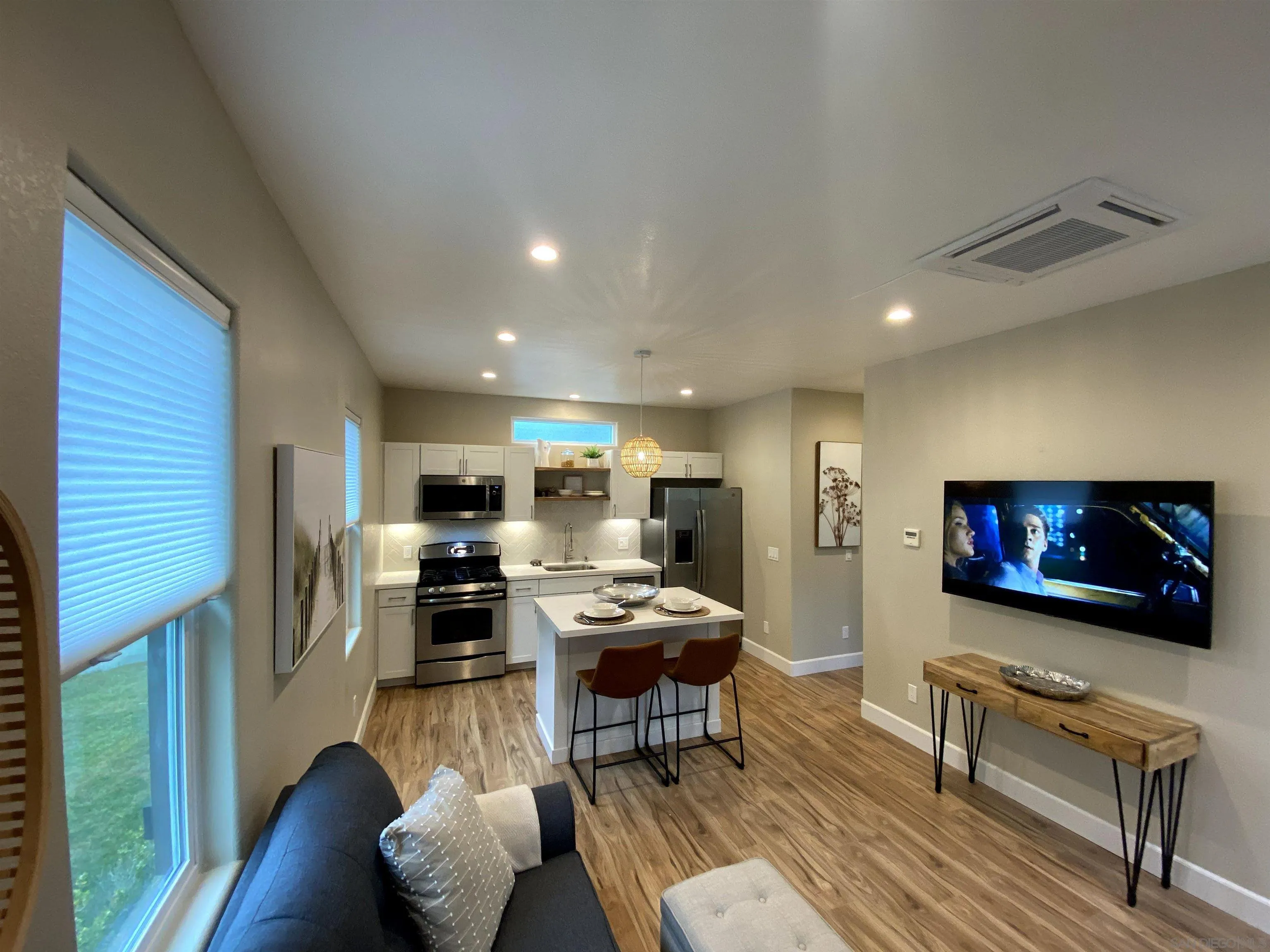 1774 Dove Lane Carlsbad, CA 92011 - Photo 2 of 25 a living room with furniture and a flat screen tv