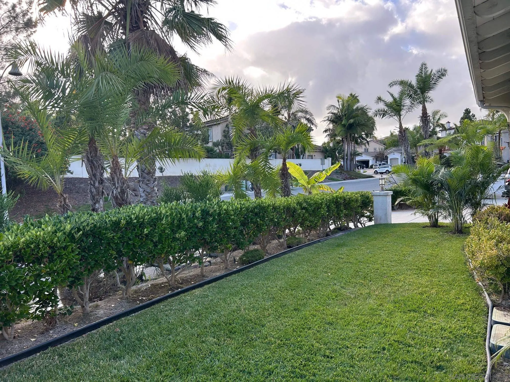 1774 Dove Lane Carlsbad, CA 92011 - Photo 21 of 25 a view of a garden with a building in the background