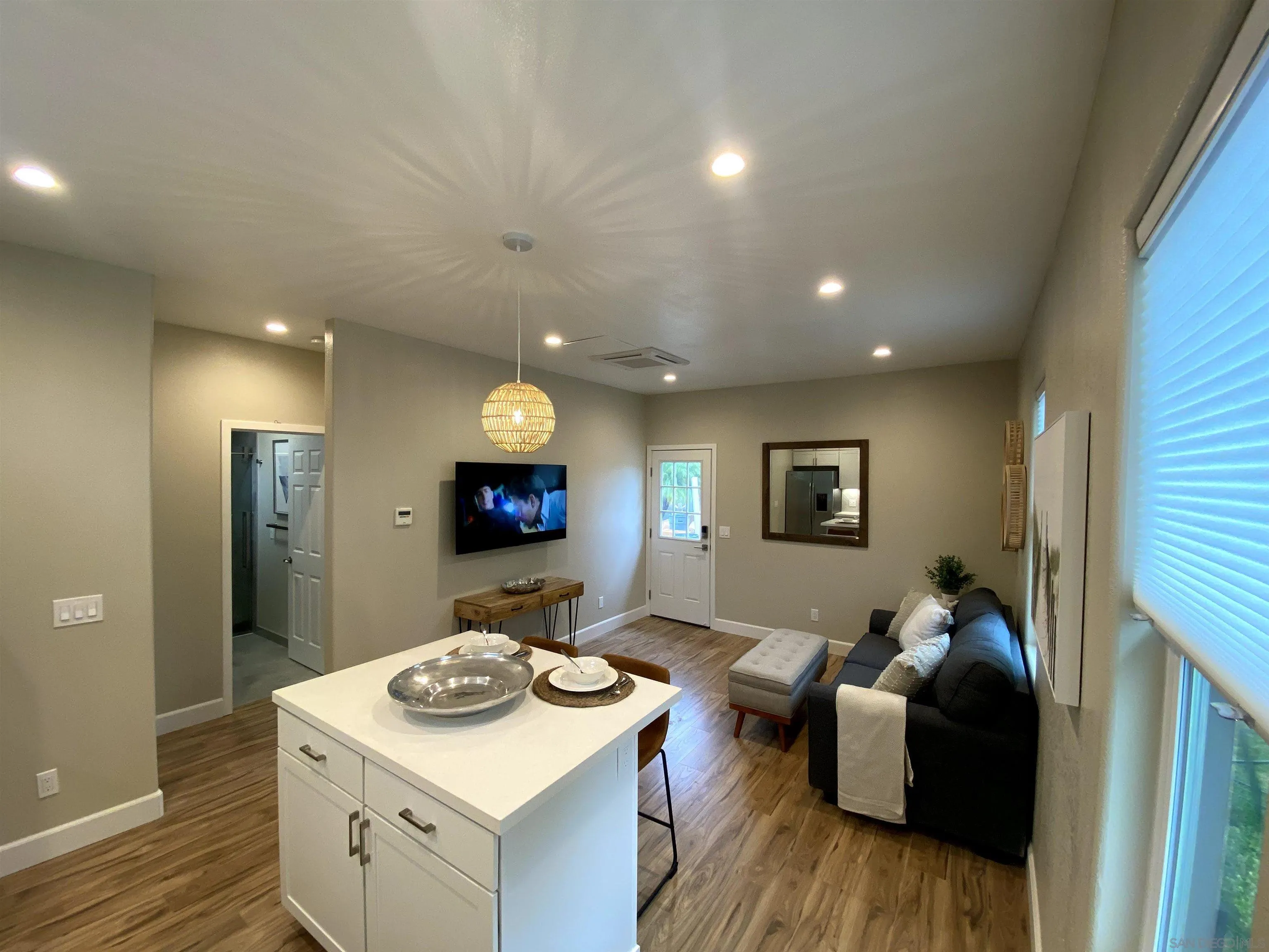 1774 Dove Lane Carlsbad, CA 92011 - Photo 4 of 25 a living room with furniture and a wooden floor