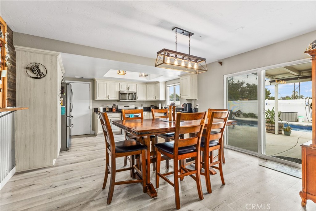 3998 Bluff Street Norco, CA 92860 - Photo 11 of 74 a view of a dining room with furniture and chandelier