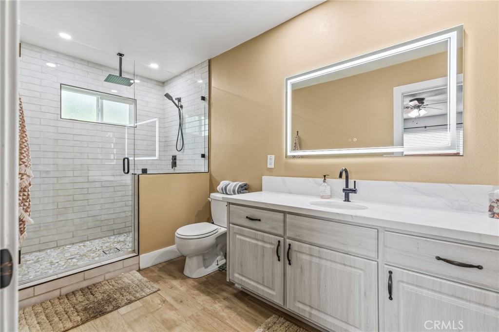 3998 Bluff Street Norco, CA 92860 - Photo 24 of 74 a bathroom with a sink a toilet and shower