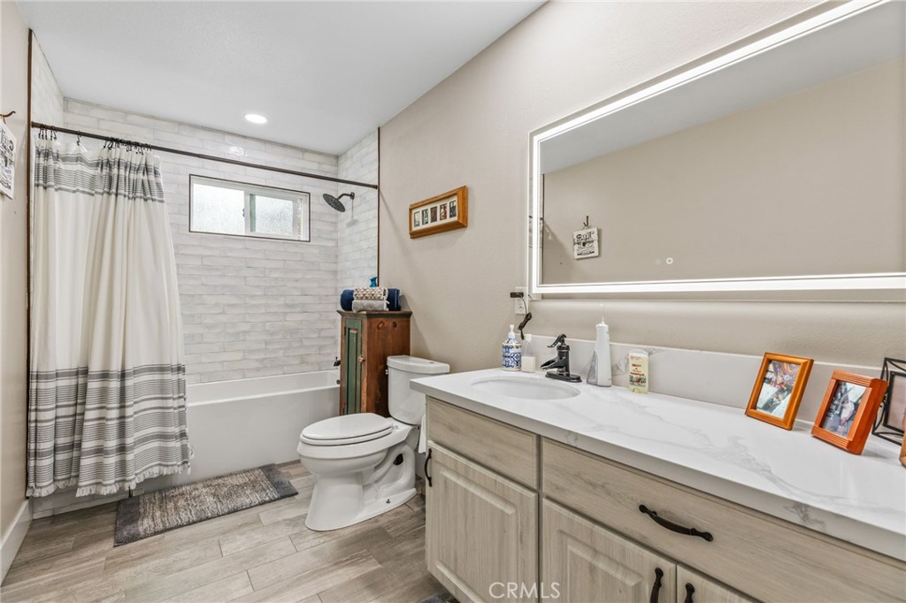 3998 Bluff Street Norco, CA 92860 - Photo 26 of 74 a bathroom with a sink toilet and shower