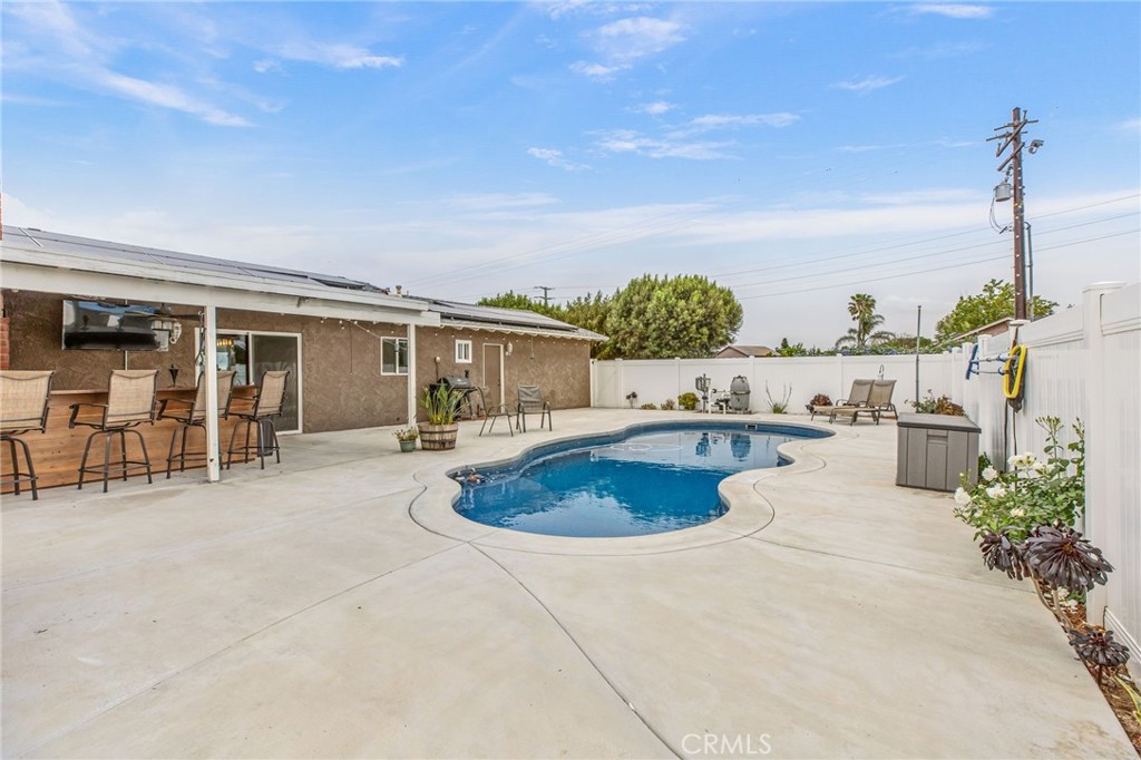 3998 Bluff Street Norco, CA 92860 - Photo 31 of 74 a view of a house with swimming pool and sitting area