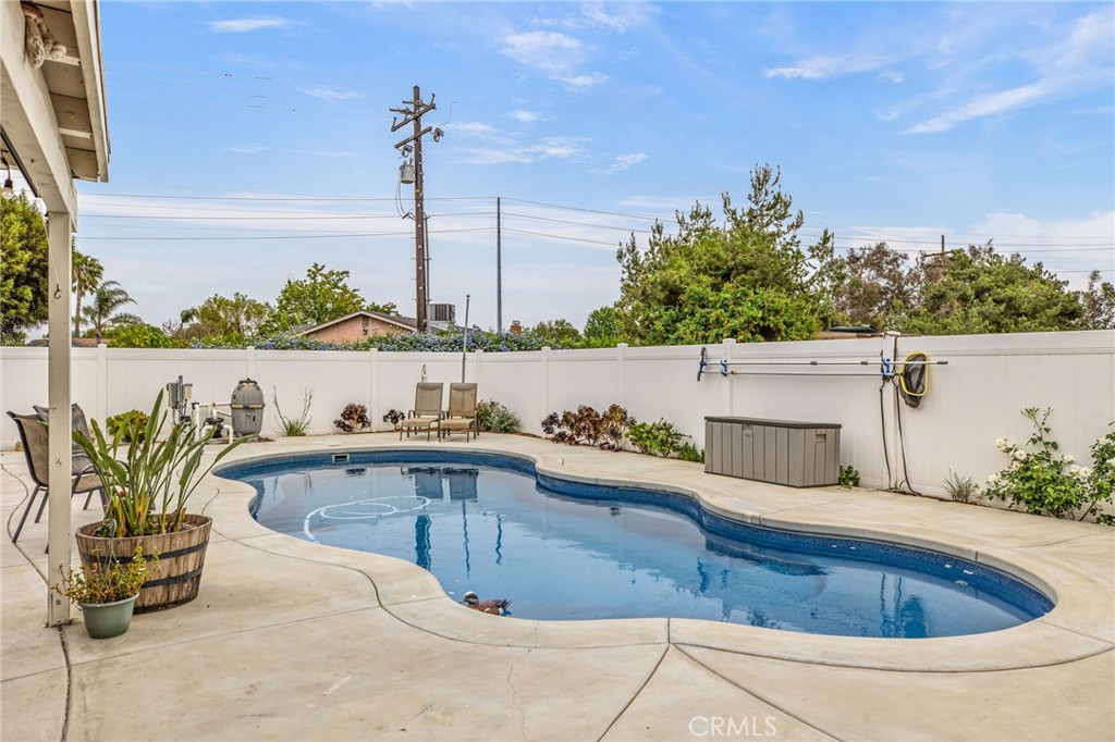 3998 Bluff Street Norco, CA 92860 - Photo 35 of 74 a view of a swimming pool with a lounge chairs
