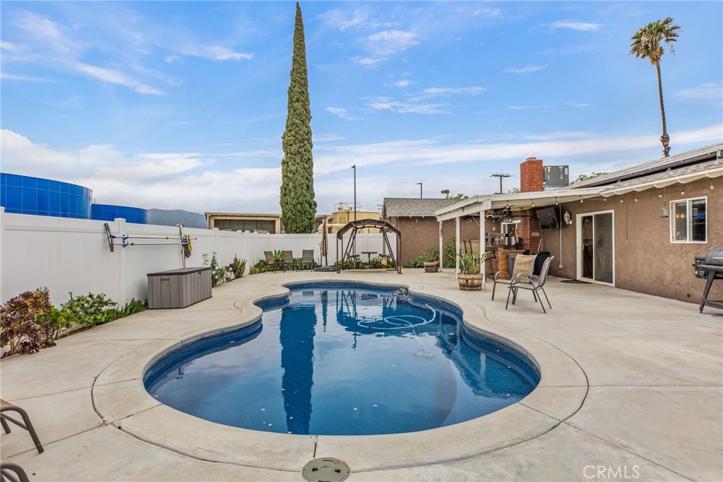 3998 Bluff Street Norco, CA 92860 - Photo 36 of 74 a view of a swimming pool with a patio