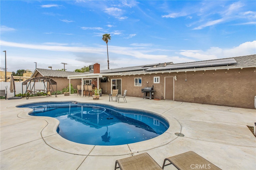 3998 Bluff Street Norco, CA 92860 - Photo 45 of 74 a view of a swimming pool with a outdoor seating