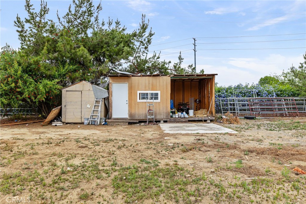 3998 Bluff Street Norco, CA 92860 - Photo 46 of 74 a view of a house with backyard and trees