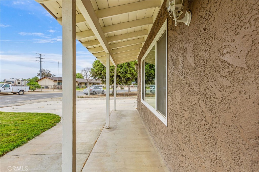 3998 Bluff Street Norco, CA 92860 - Photo 5 of 74 a porch with a bench in front of door