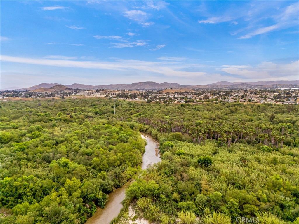 3998 Bluff Street Norco, CA 92860 - Photo 74 of 74 a view of a city with lush green forest