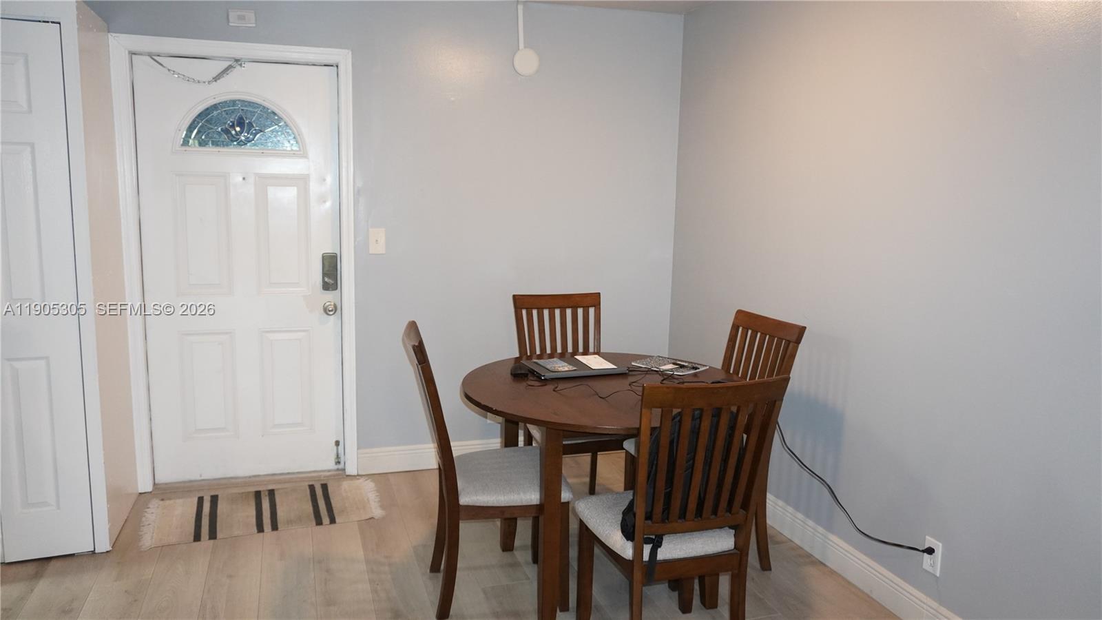 3710 North Pine Island Road, Unit 320 Sunrise, FL 33351 - Photo 5 of 14 a view of a dining room with furniture and a table