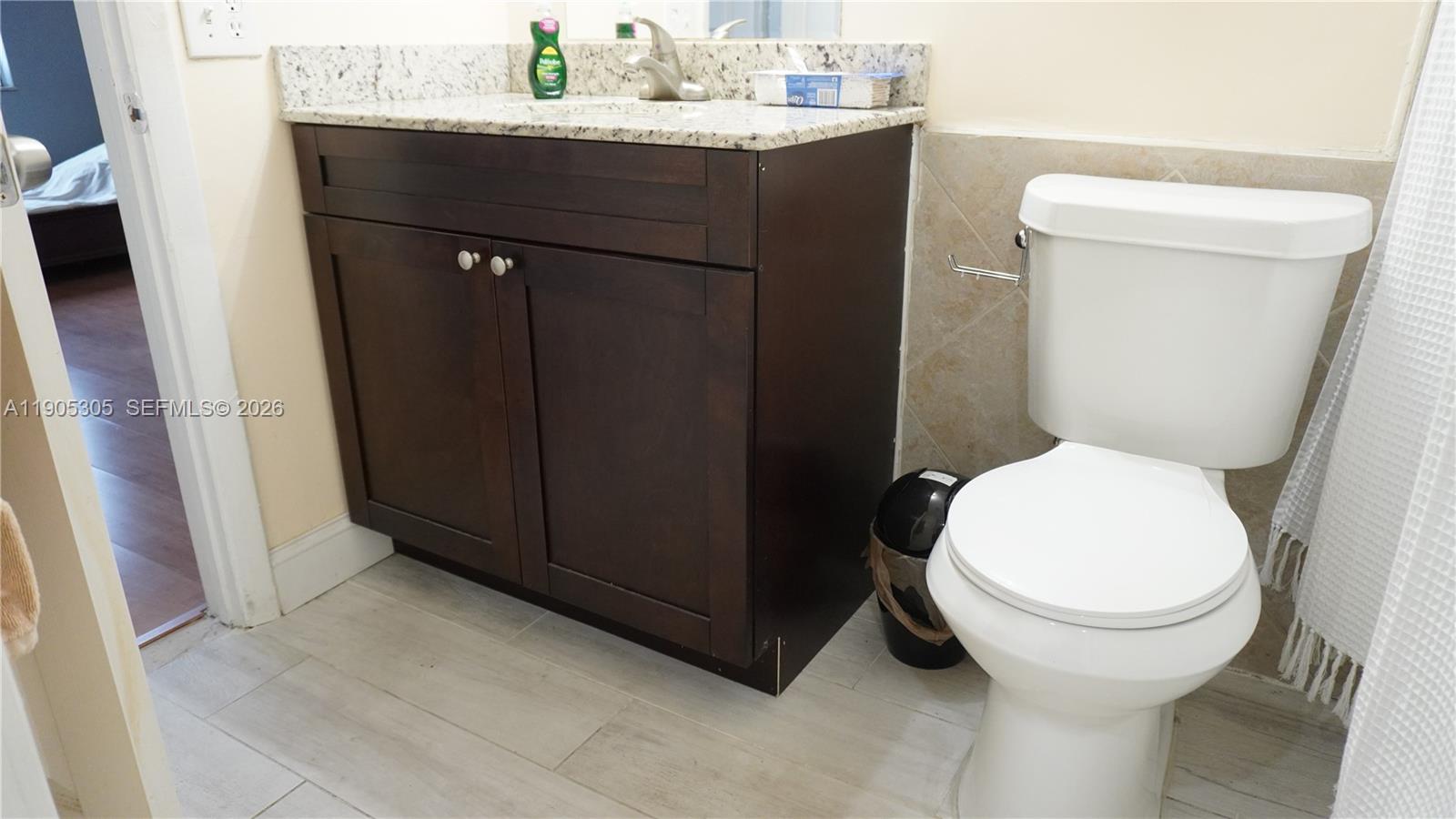 3710 North Pine Island Road, Unit 320 Sunrise, FL 33351 - Photo 8 of 14 a bathroom with a sink and a toilet