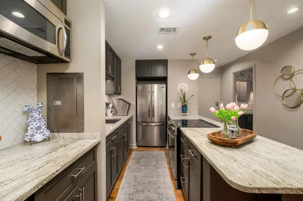 a kitchen with a refrigerator and countertop