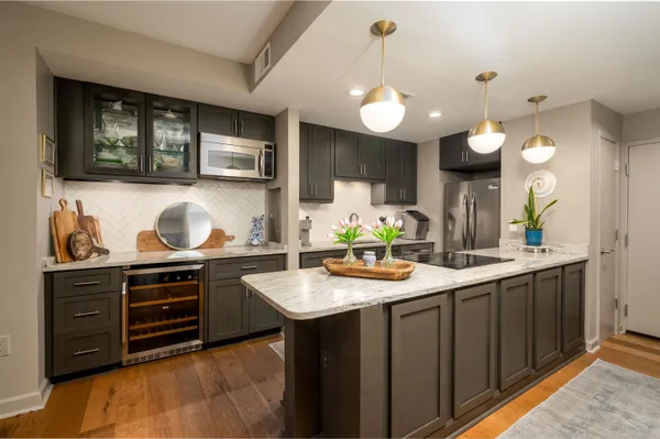 a kitchen with a sink and cabinets
