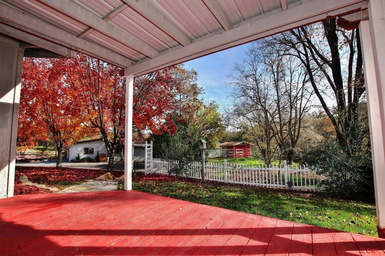 a view of a patio with a yard