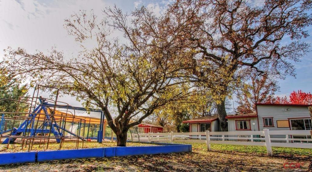 12275 Alondra Road Atascadero, CA 93422 - Photo 16 of 25 a front view of a house with a tree and a yard