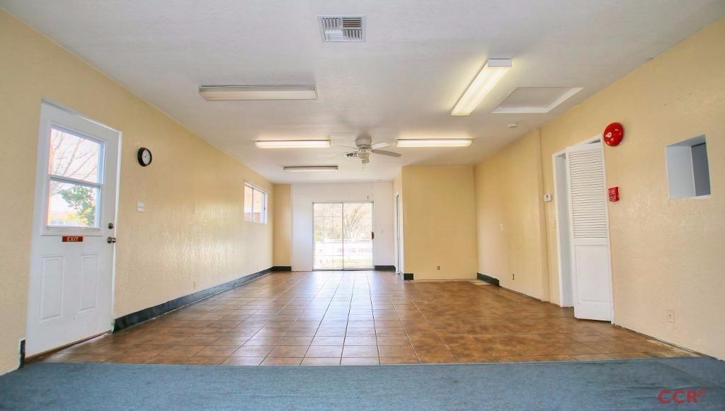 12275 Alondra Road Atascadero, CA 93422 - Photo 18 of 25 an empty room with wooden floor and windows