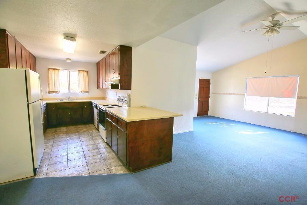 12275 Alondra Road Atascadero, CA 93422 - Photo 19 of 25 a large kitchen with stainless steel appliances granite countertop a sink counter space and cabinets