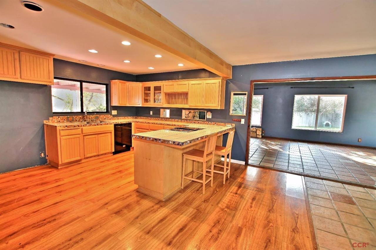 12275 Alondra Road Atascadero, CA 93422 - Photo 5 of 25 a kitchen with stainless steel appliances granite countertop a stove a sink dishwasher and a microwave oven with white countertops