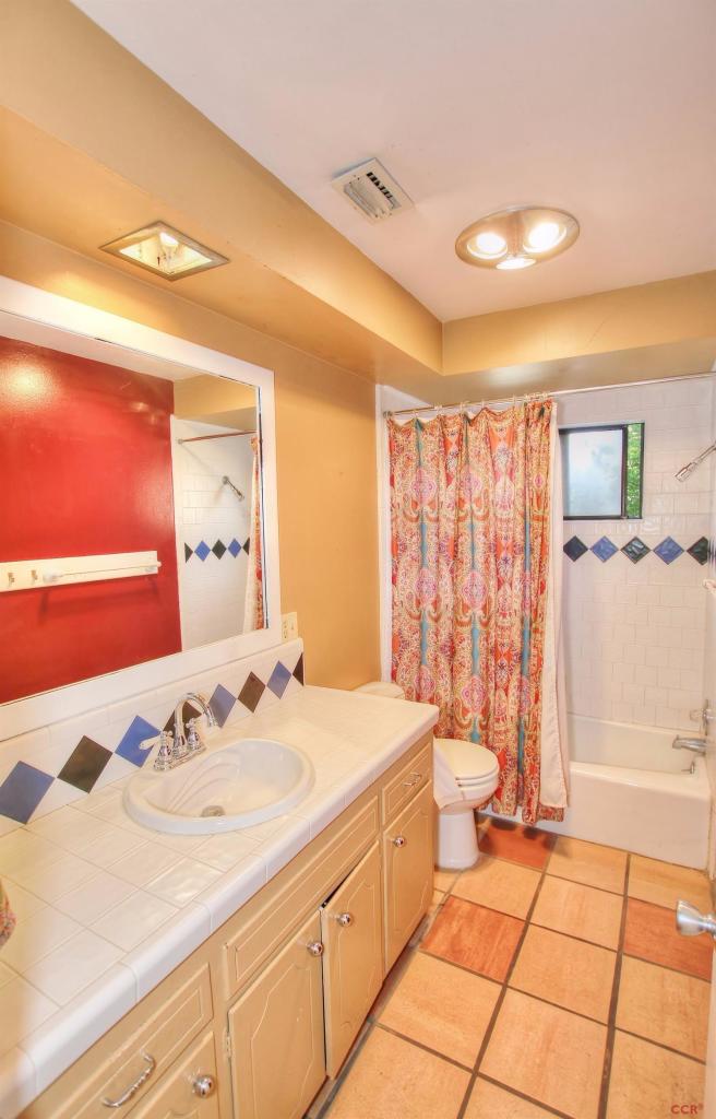 12275 Alondra Road Atascadero, CA 93422 - Photo 7 of 25 a spacious bathroom with a sink a toilet and a shower