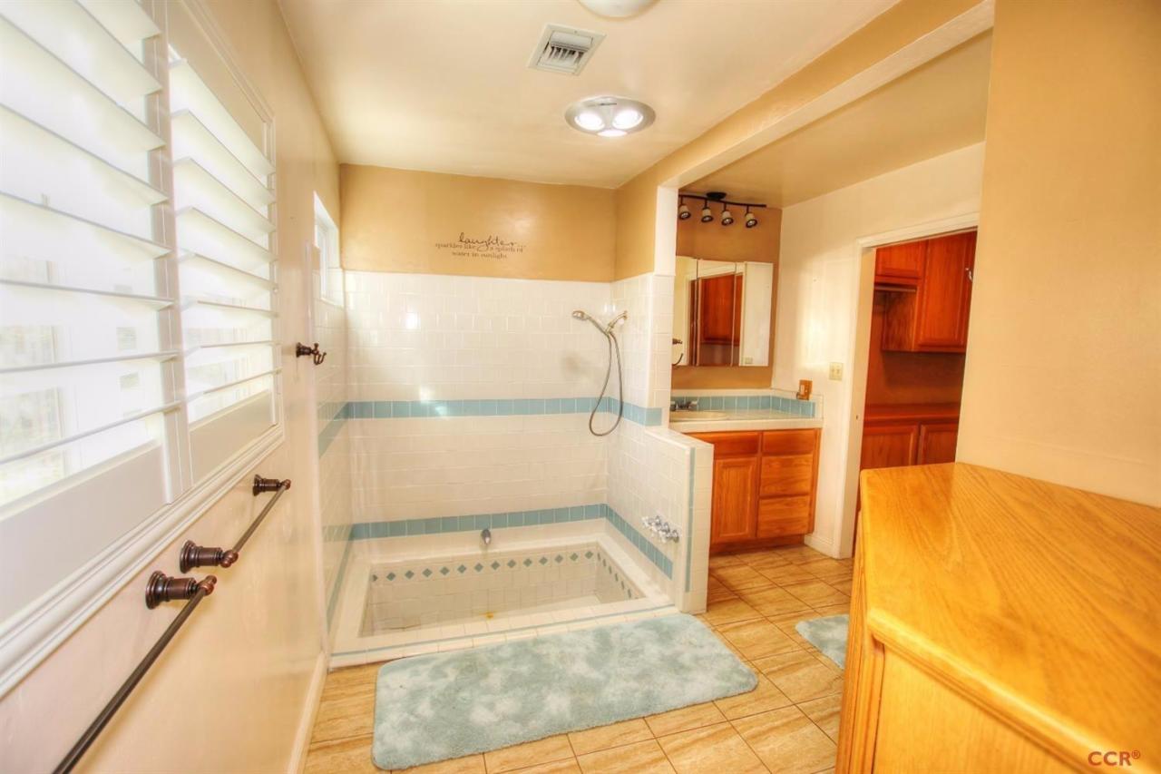 12275 Alondra Road Atascadero, CA 93422 - Photo 8 of 25 a bathroom with a tub sink and mirror