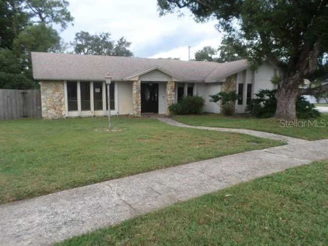 a front view of a house with a garden and porch