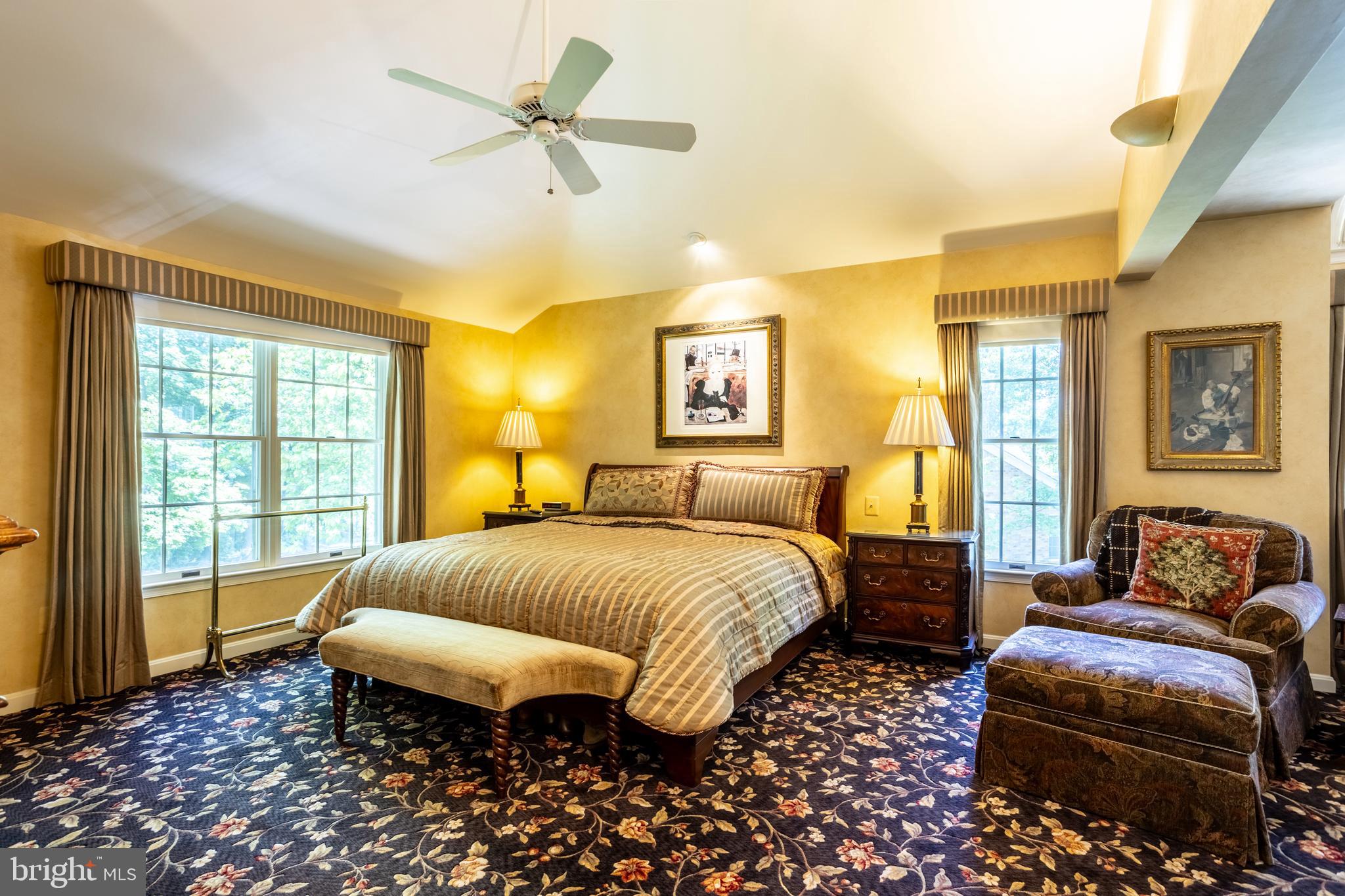 63 Raisin Tree Circle Baltimore, MD 21208 - Photo 25 of 57 a spacious bedroom with two beds and a chandelier