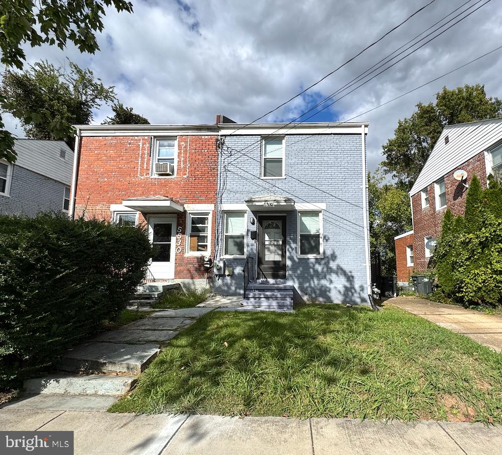 front view of a house with a yard