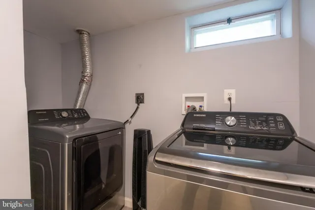 a stove top oven sitting inside of a kitchen