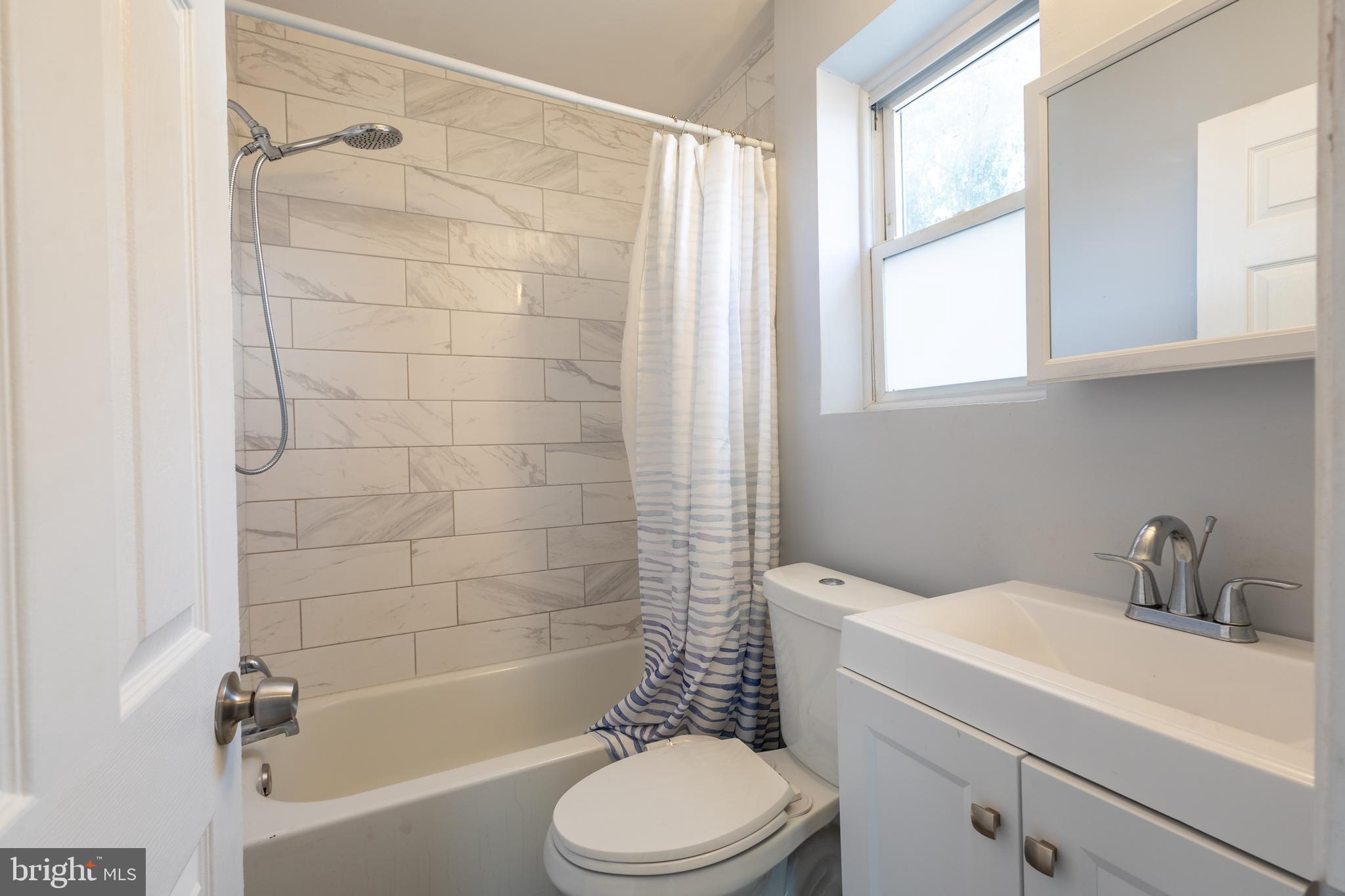 5532 B Street Southeast Washington, DC 20019 - Photo 18 of 19 a bathroom with a sink toilet and shower
