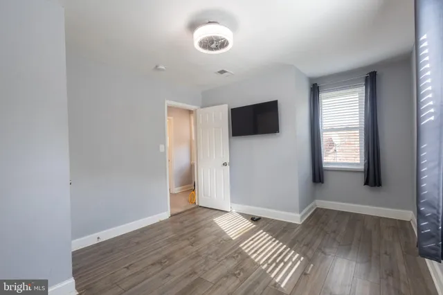 a view of a livingroom with wooden floor