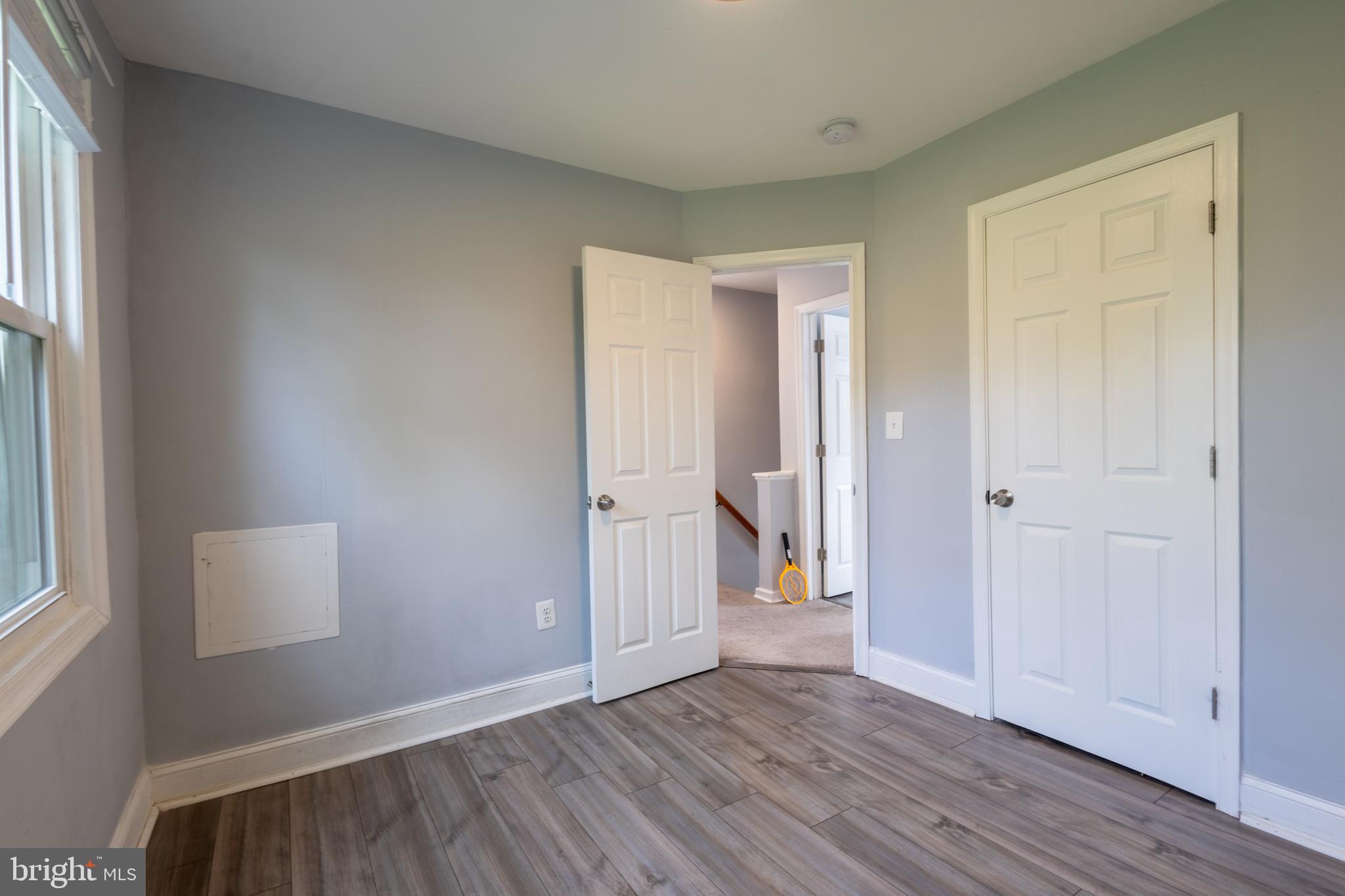 5532 B Street Southeast Washington, DC 20019 - Photo 4 of 19 an empty room with wooden floor and windows