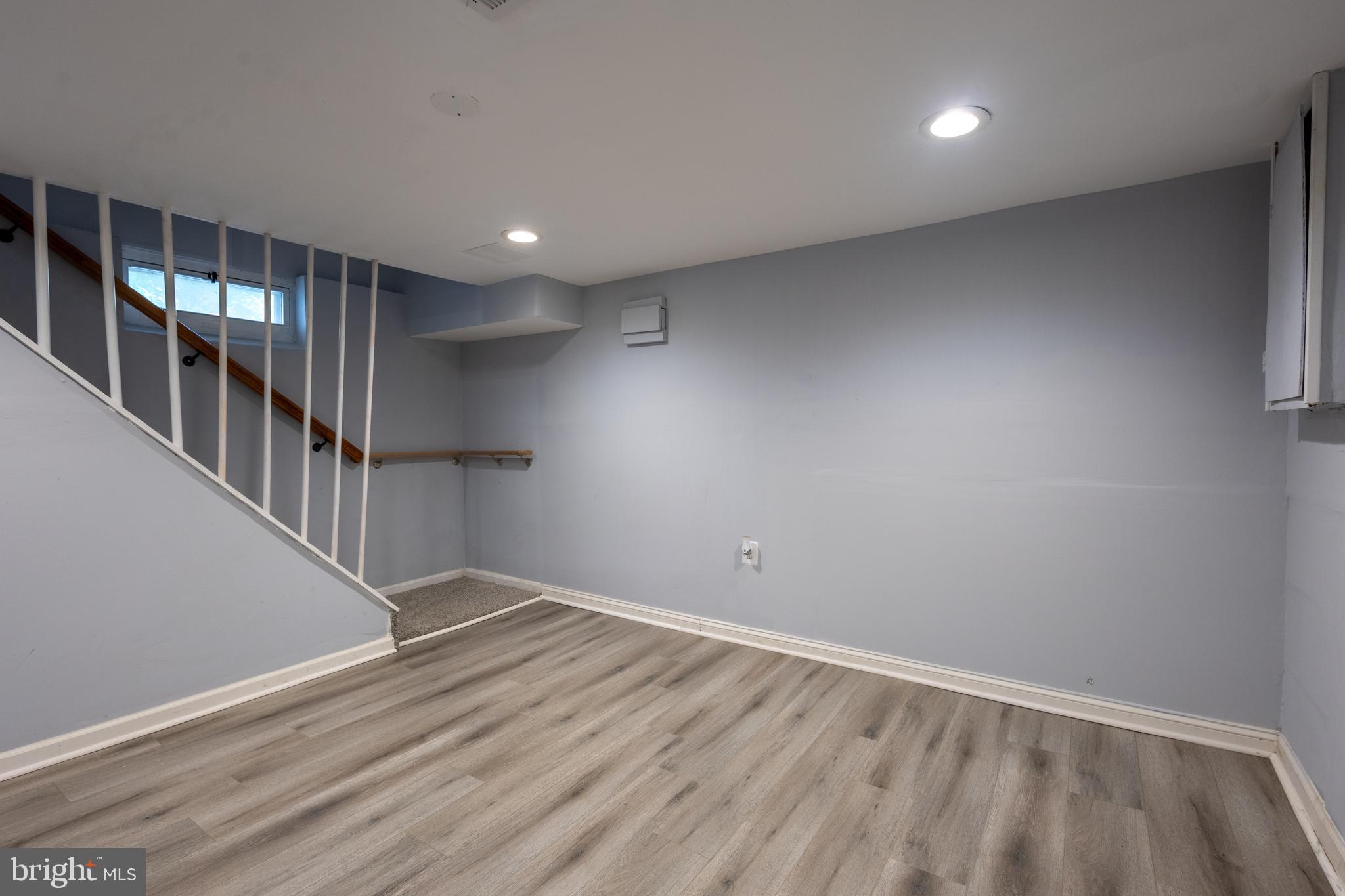 5532 B Street Southeast Washington, DC 20019 - Photo 7 of 19 wooden floor in an empty room with a window