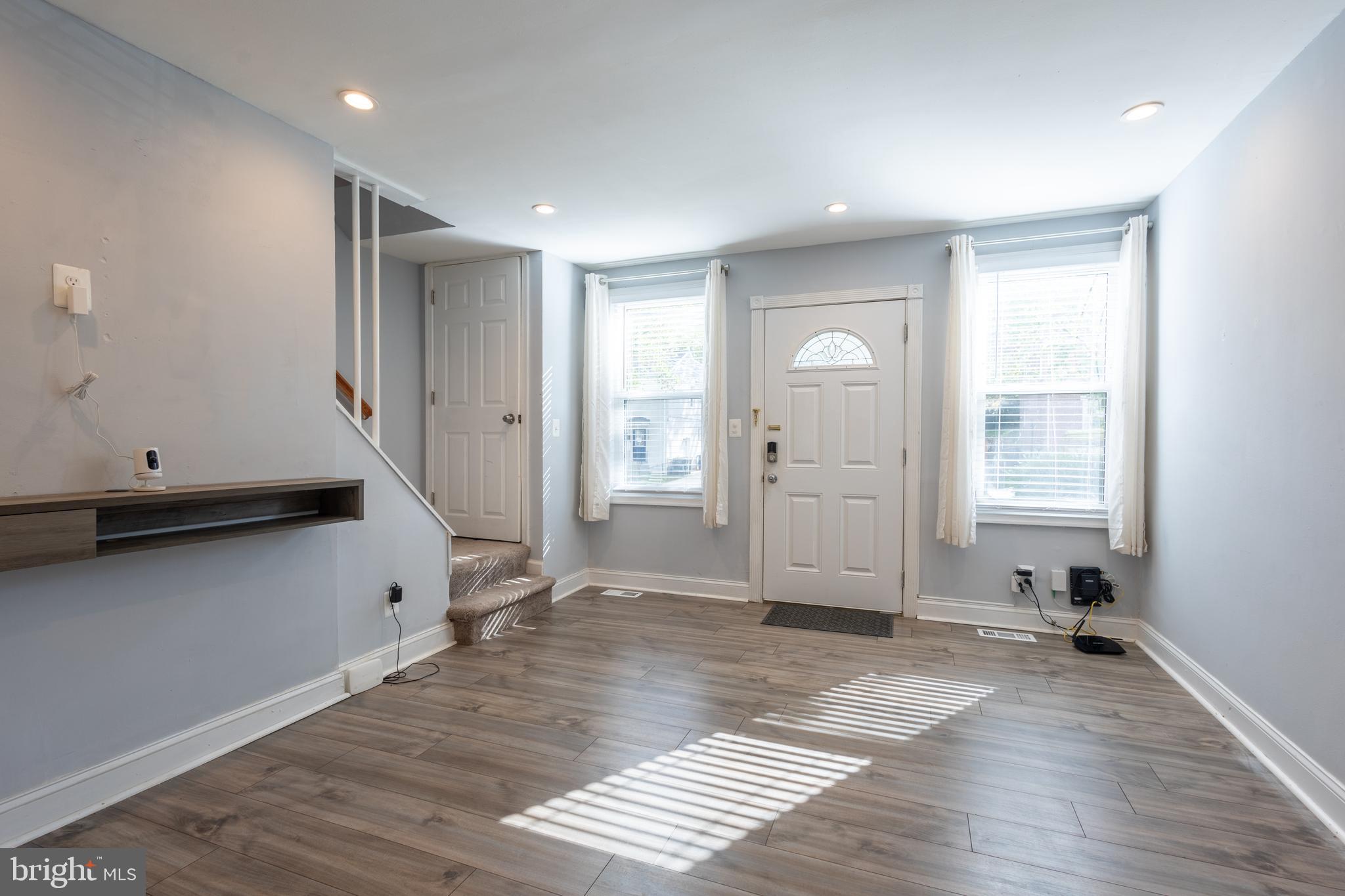 5532 B Street Southeast Washington, DC 20019 - Photo 9 of 19 a view of an empty room with wooden floor and a window