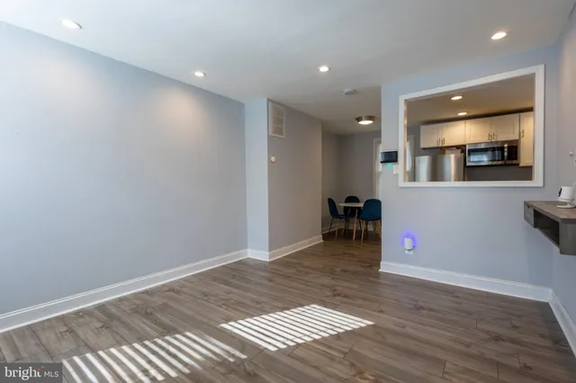 a view of a livingroom with wooden floor