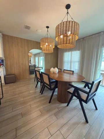 an aerial view of residential houses with outdoor space and street view