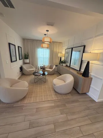 a kitchen with stainless steel appliances granite countertop a sink a stove and refrigerator