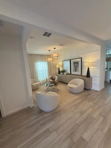a kitchen with a sink and a mirror