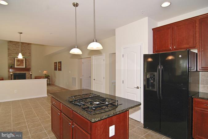 11103 Rodeo Court Upper Marlboro, MD 20772 - Photo 3 of 15 a kitchen with stainless steel appliances granite countertop a refrigerator a stove and a refrigerator
