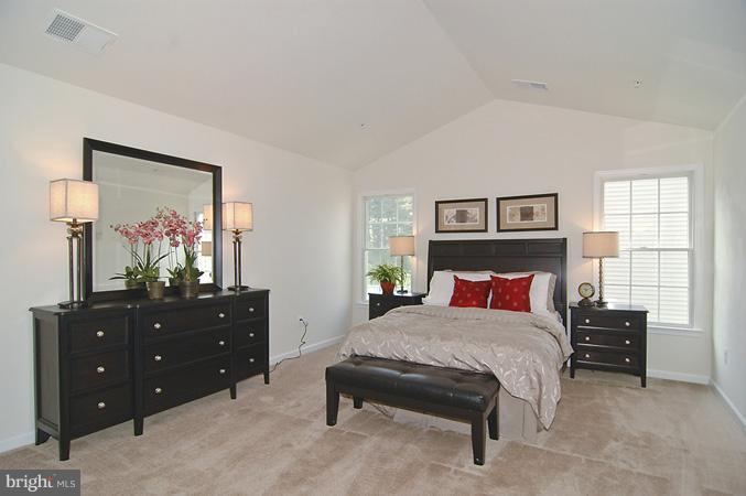 11103 Rodeo Court Upper Marlboro, MD 20772 - Photo 7 of 15 a bedroom with a bed and a dresser