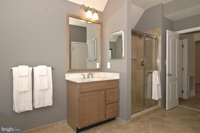 11103 Rodeo Court Upper Marlboro, MD 20772 - Photo 8 of 15 a bathroom with a double vanity sink and mirror