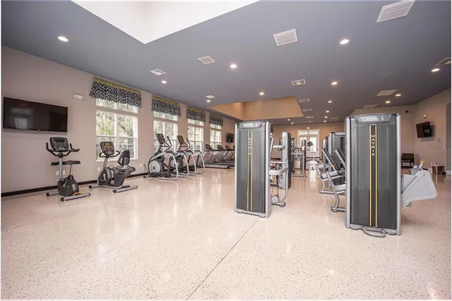 a view of living room with furniture and large windows