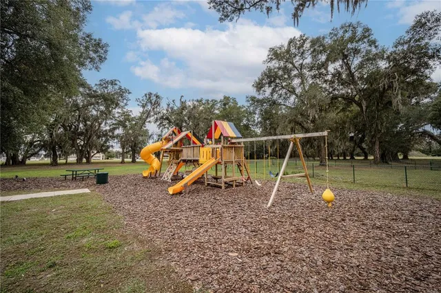 a living room with lots of furniture and lots of furniture