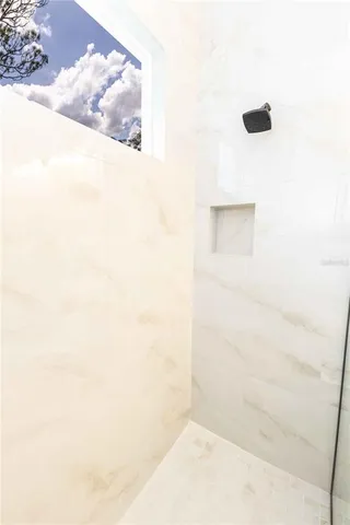 a bathroom with a toilet and a bathtub